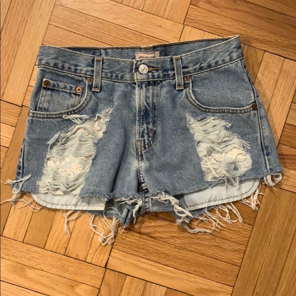 Levi cut off Jean shorts with lace detail
